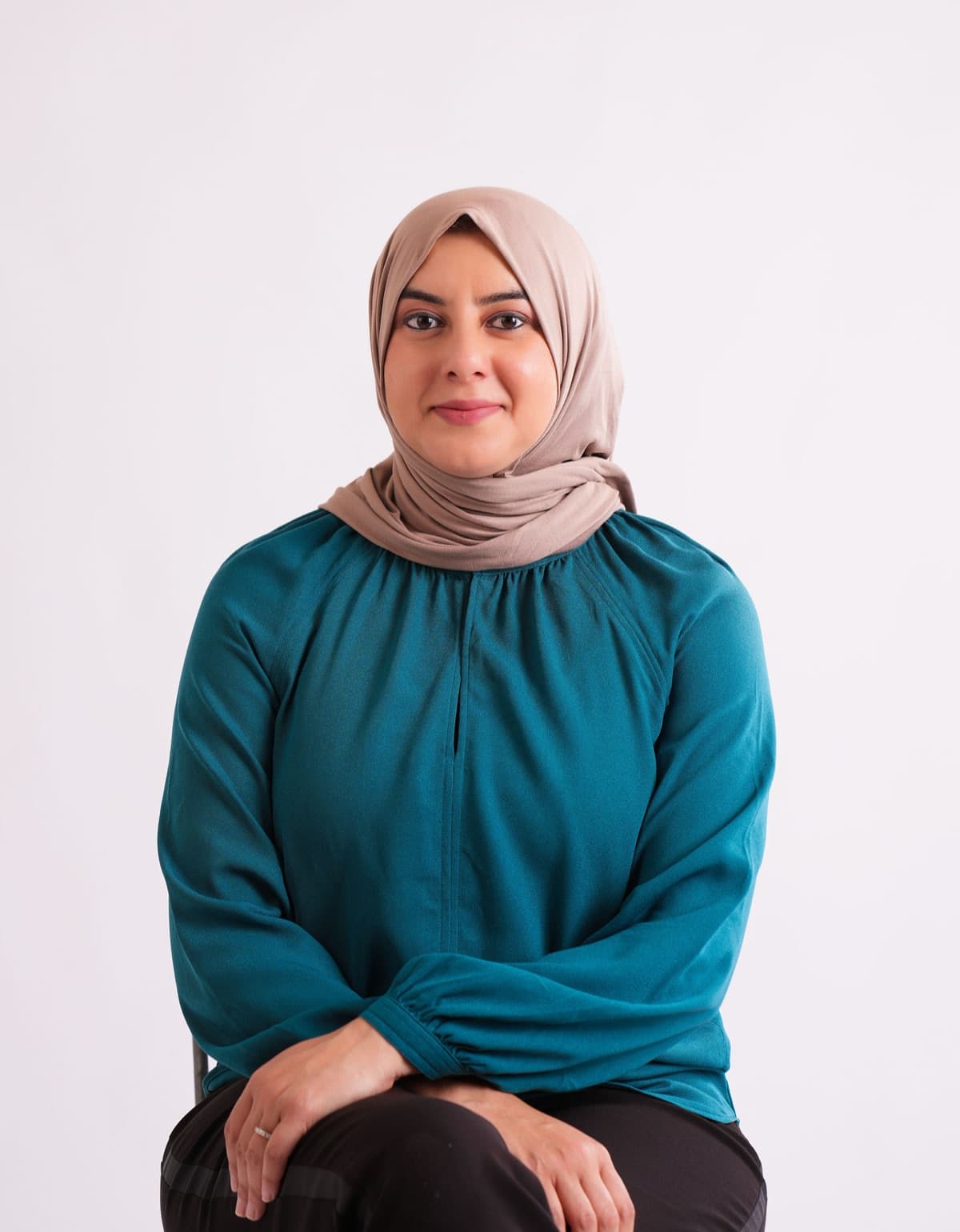 Benazir Jusab, Registered Dietitian, seated portrait